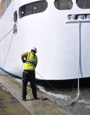 Crew member pulling the line