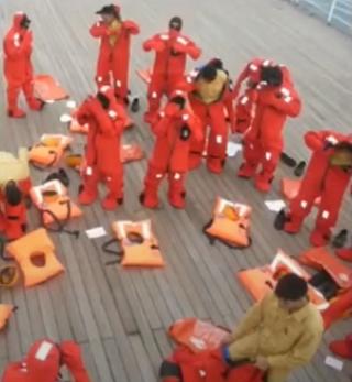 Crew in immersion suits