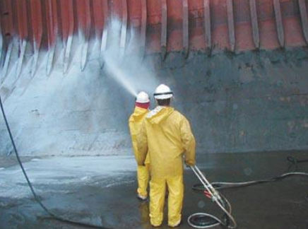 People hosing down cargo hold